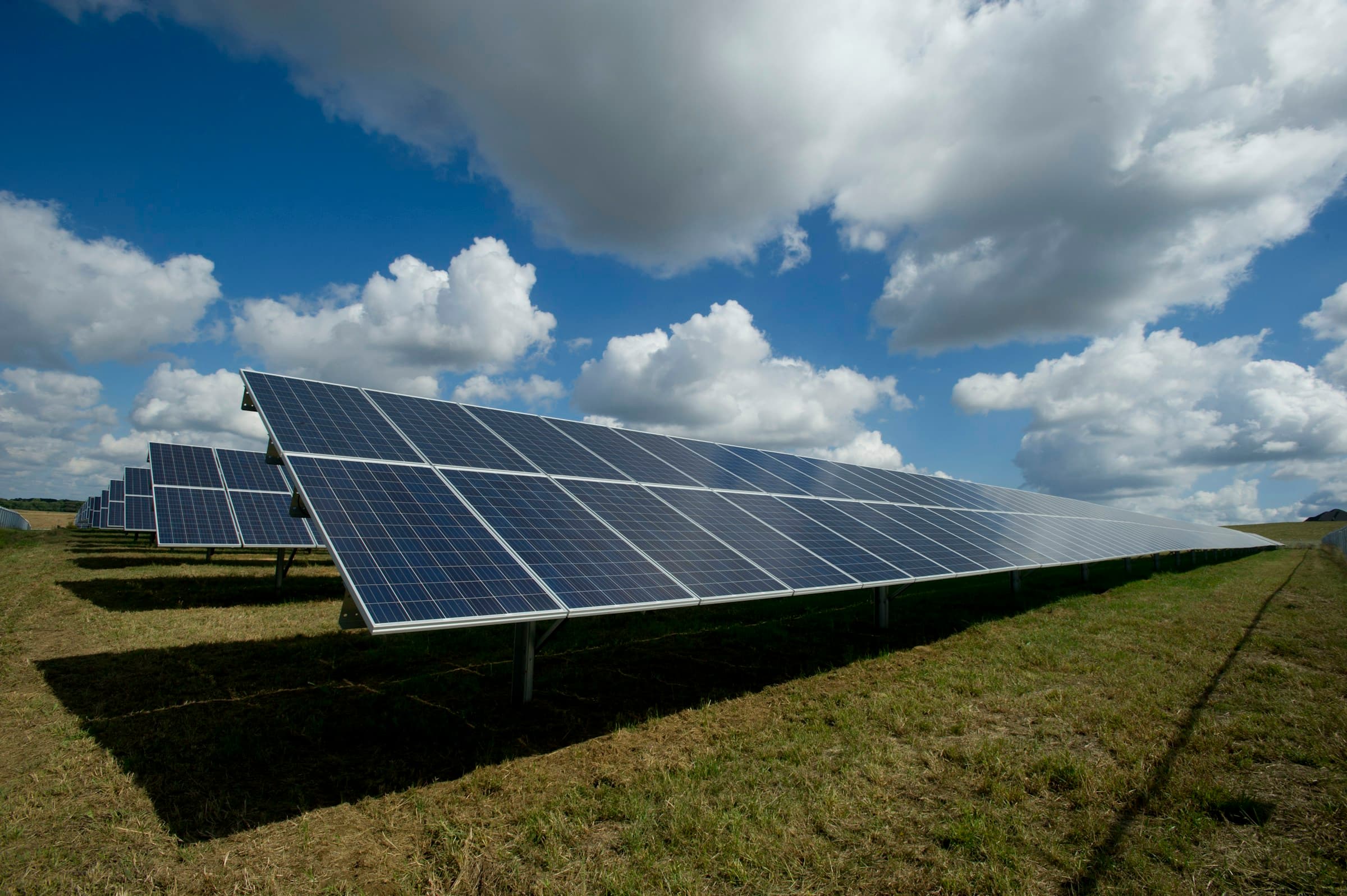 Aerial view of utility-scale solar farm — bankable generation underpinning long-term PPA offtake